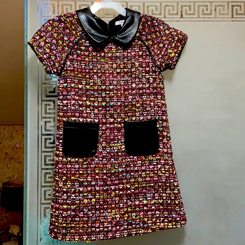 Brand new dress with leather pockets and collar. Size 5.